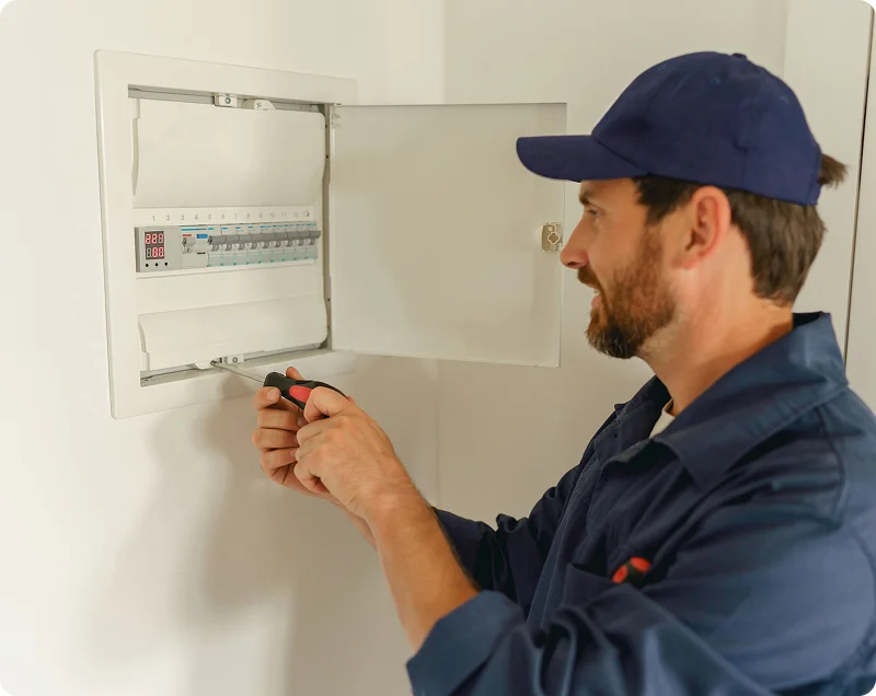 Licensed electrician from In Charge Electrical following safety procedures