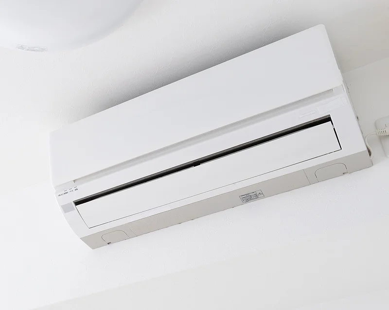 Wall-mounted heat pump installed in open-plan living area